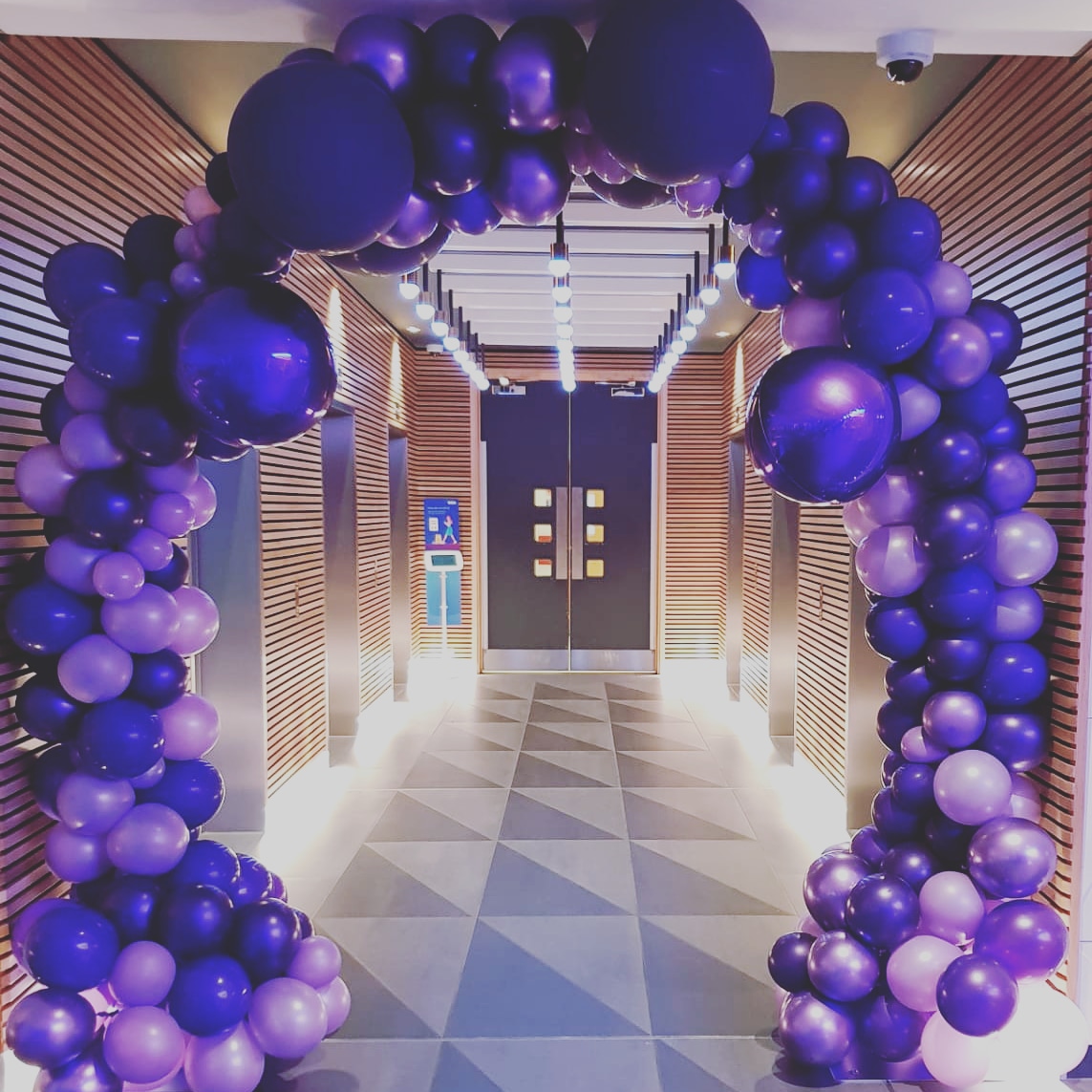 Purple Organic Balloon Arch created for International Women's Day celebrations